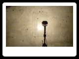 subroom :  icarus after the fall (tripod - sun gun lamp -etched and mounted glass )